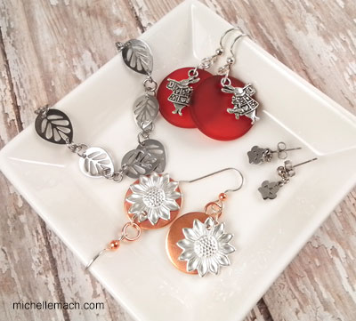 A variety of handmade earrings in a dish